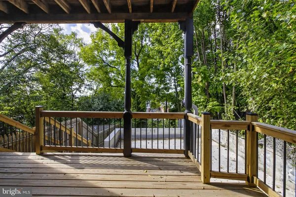 a view of a wooden balcony with wooden floor