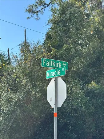 a street sign on a pole on a street