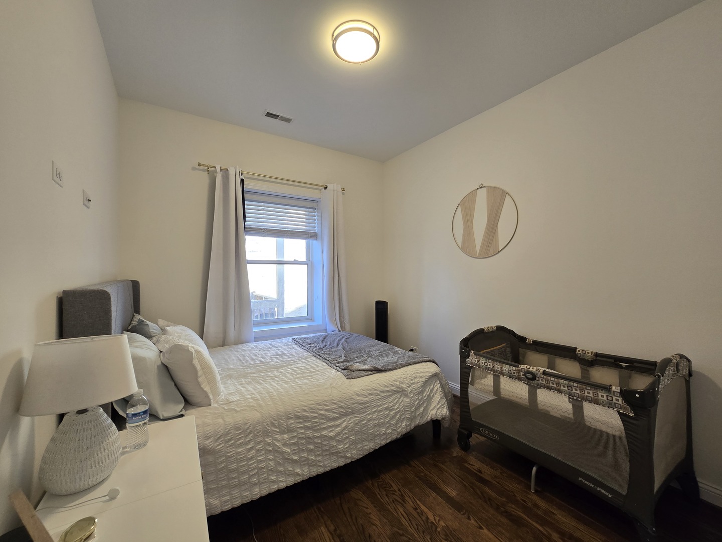 723 West 34th Street, Unit 2E Chicago, IL 60616 - Photo 5 of 9 a bedroom with a bed and window