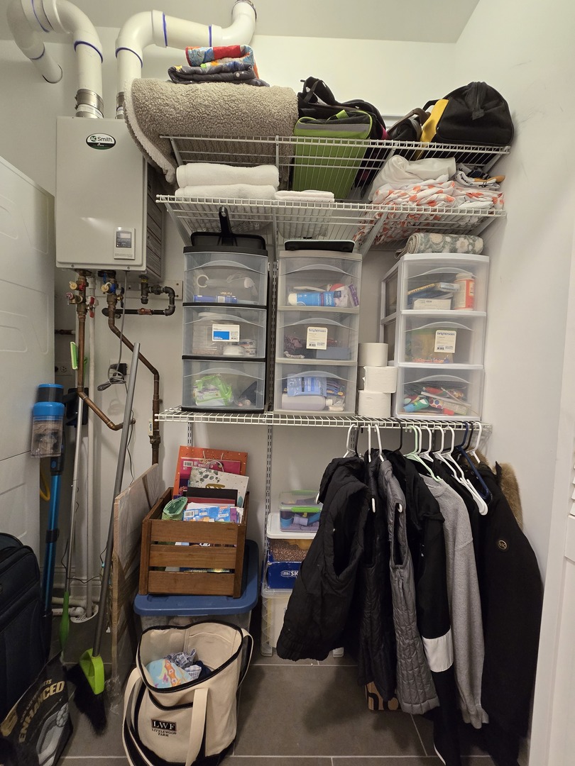 723 West 34th Street, Unit 2E Chicago, IL 60616 - Photo 8 of 9 a view of walk in closet with clothes and shoes