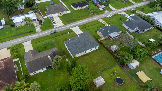 an aerial view of house with yard