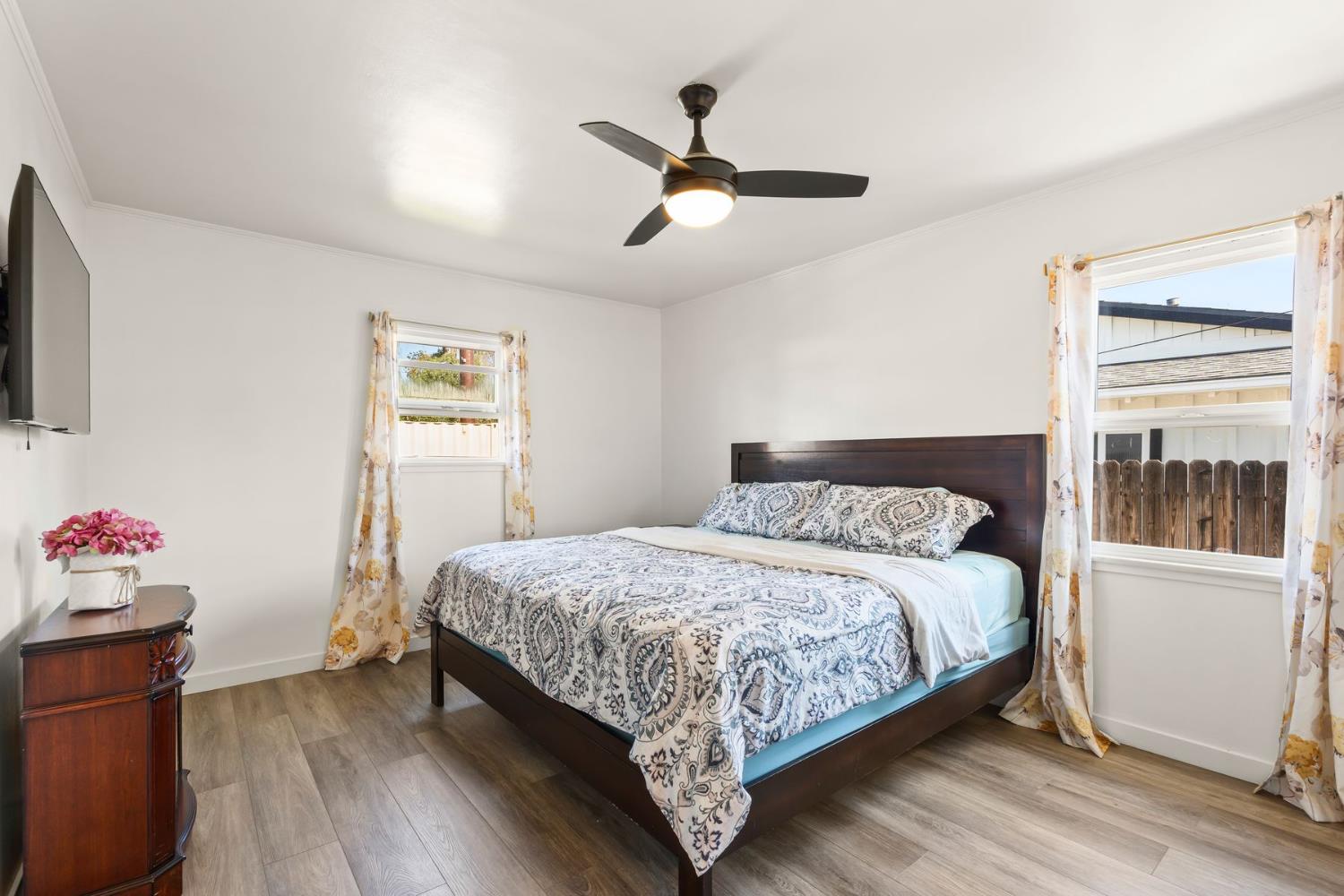 385 Sunset Avenue Oak View, CA 93022 - Photo 15 of 27 a bedroom with a bed and wooden floor