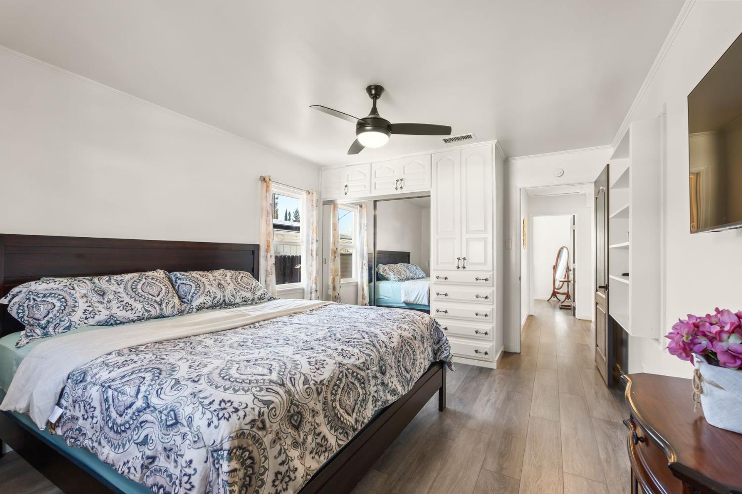 385 Sunset Avenue Oak View, CA 93022 - Photo 16 of 27 a bedroom with a bed and wooden floor