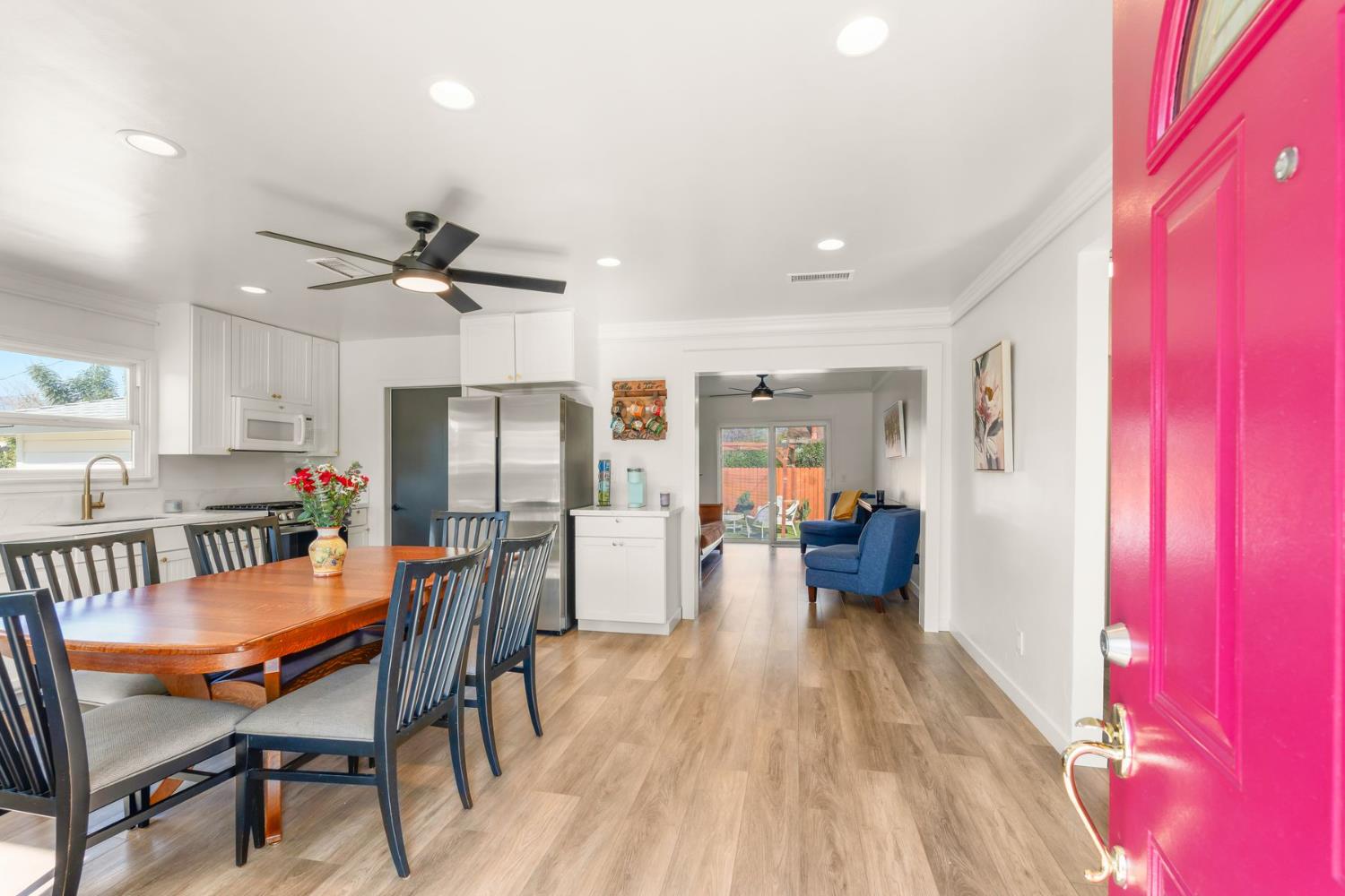 385 Sunset Avenue Oak View, CA 93022 - Photo 5 of 27 a view of a dining room with furniture a rug and wooden floor