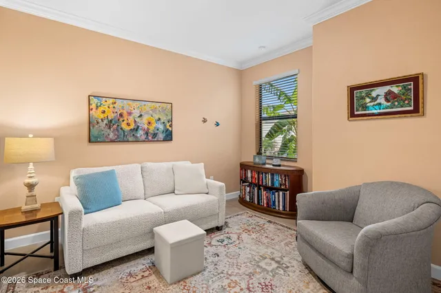 a living room with furniture and a window