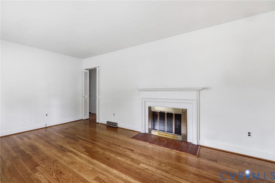 8710 Rolando Drive Henrico, VA 23229 - Photo 3 of 22 Living room wood burning fireplace