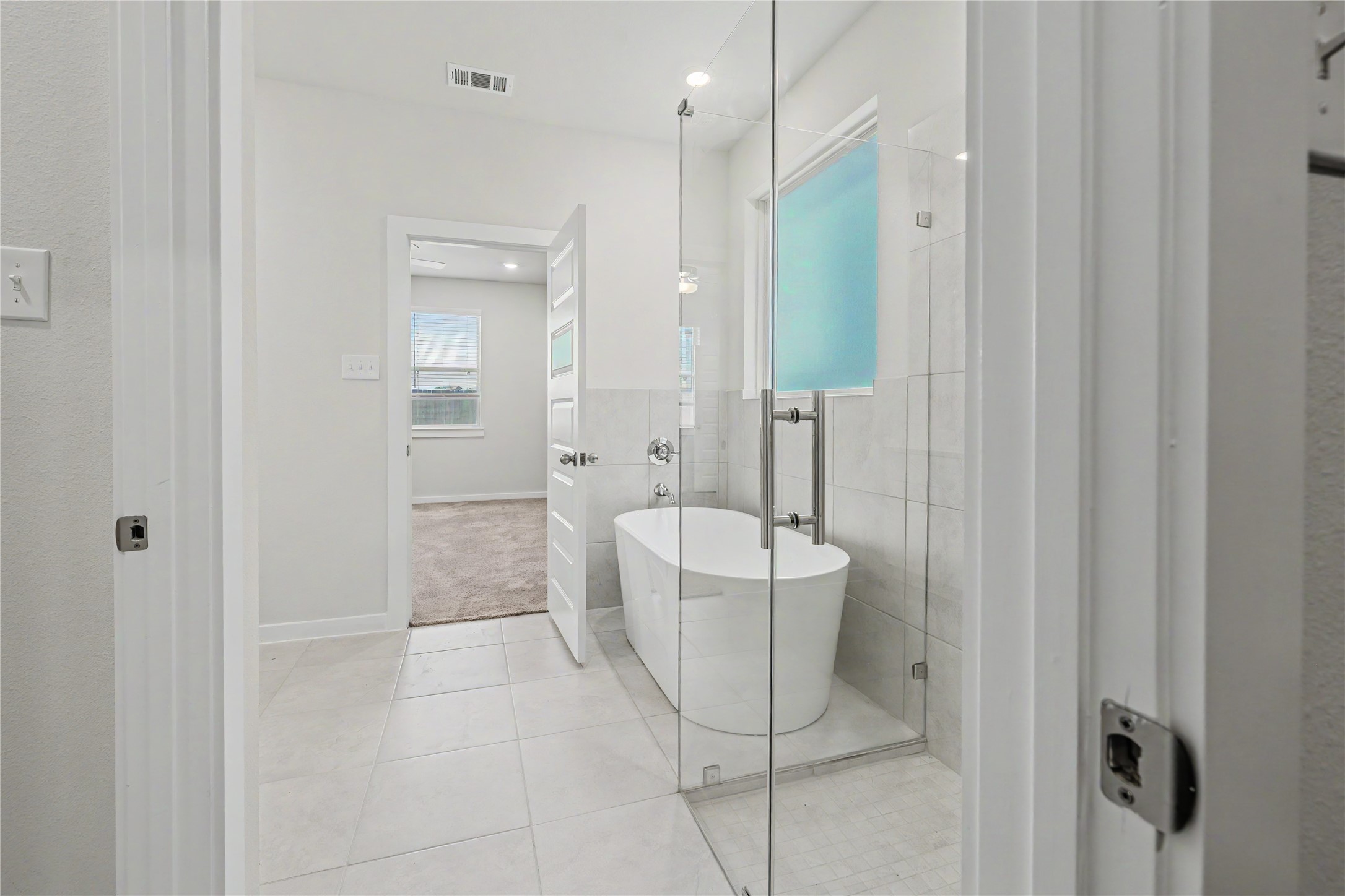 6423 Bolinas Court Rosharon, TX 77583 - Photo 34 of 39 a bathroom with a bathtub a toilet and a shower