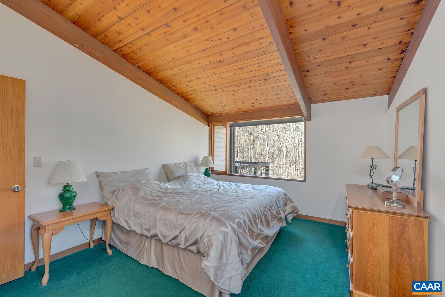 2706 Paddock Wood Road Keswick, VA 22947 - Photo 17 of 42 a spacious bedroom with a bed and a window