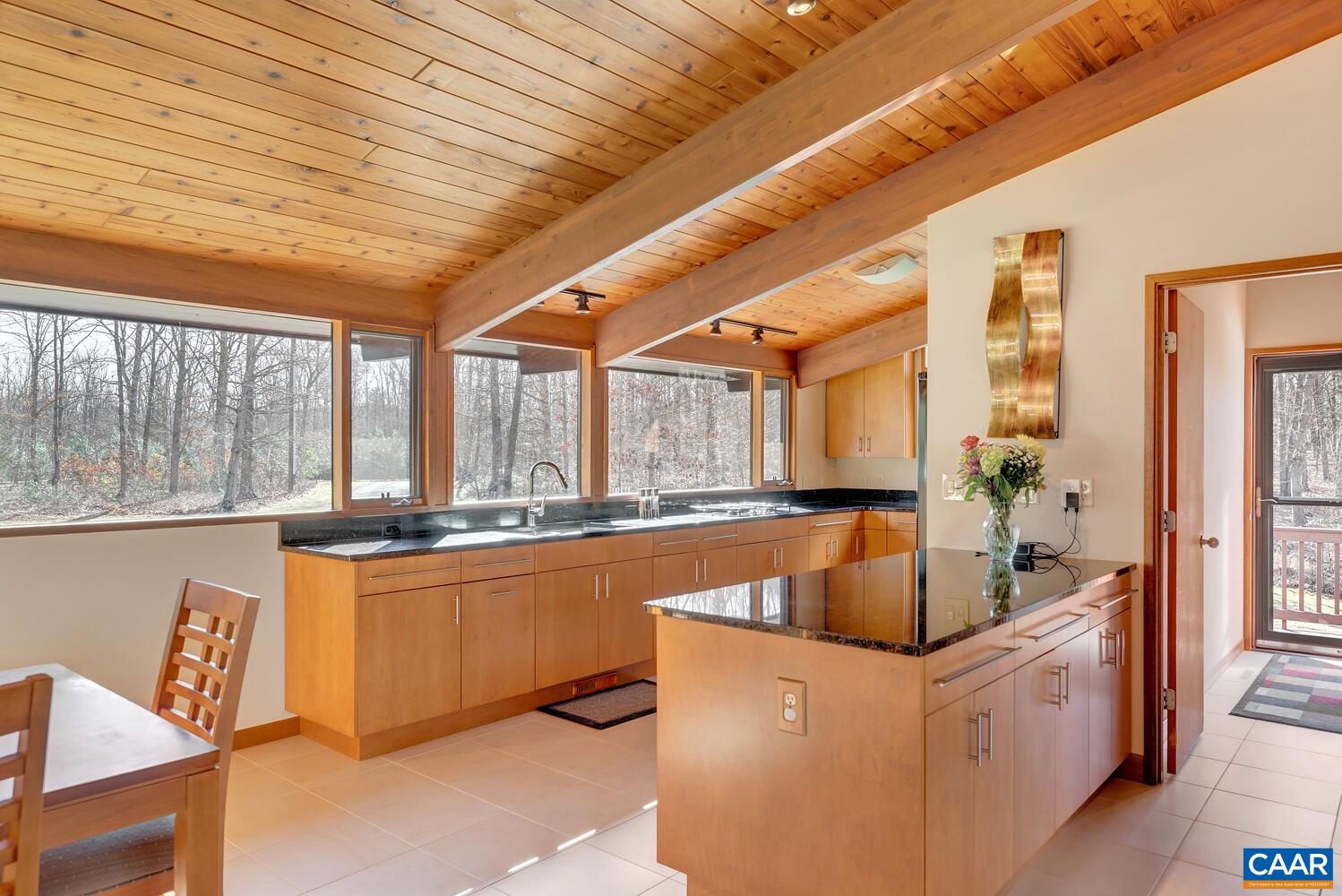 2706 Paddock Wood Road Keswick, VA 22947 - Photo 24 of 42 a large kitchen with kitchen island a large window in it