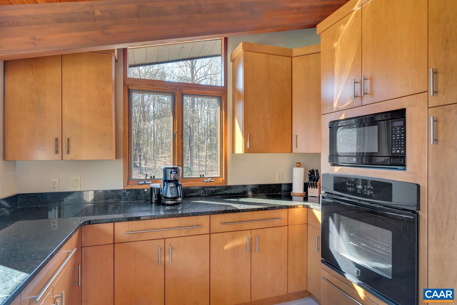 2706 Paddock Wood Road Keswick, VA 22947 - Photo 26 of 42 a kitchen with stainless steel appliances a stove sink and microwave