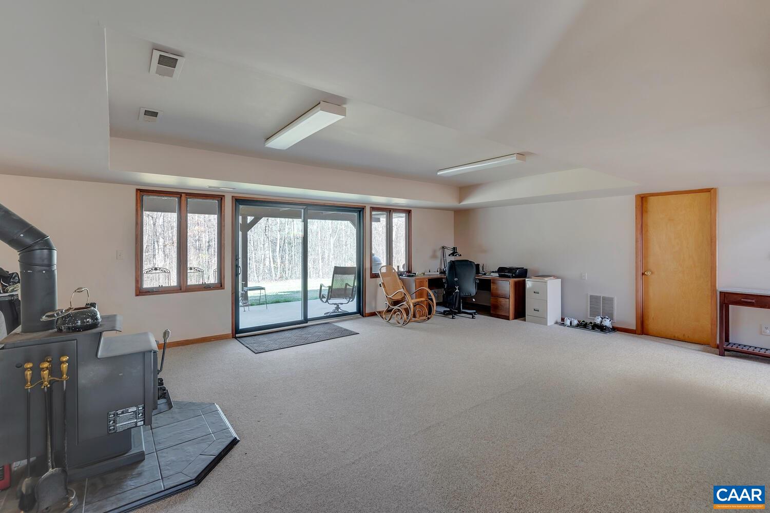 2706 Paddock Wood Road Keswick, VA 22947 - Photo 34 of 42 a view of a livingroom with furniture and a window