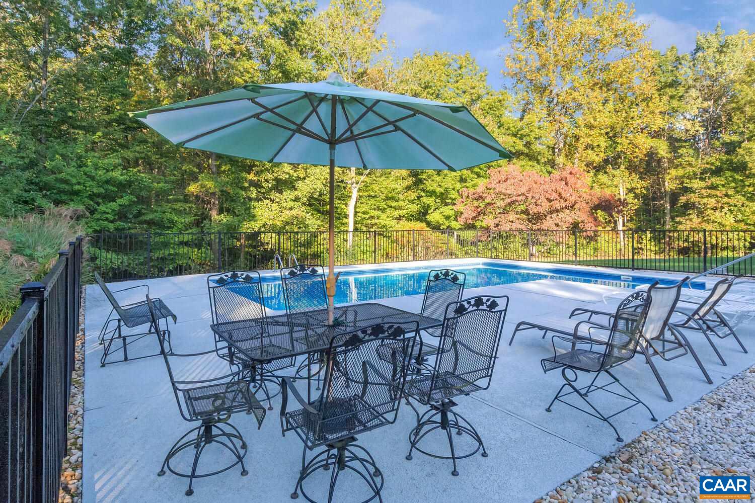 2706 Paddock Wood Road Keswick, VA 22947 - Photo 5 of 42 a view of an outdoor space with furniture and umbrella
