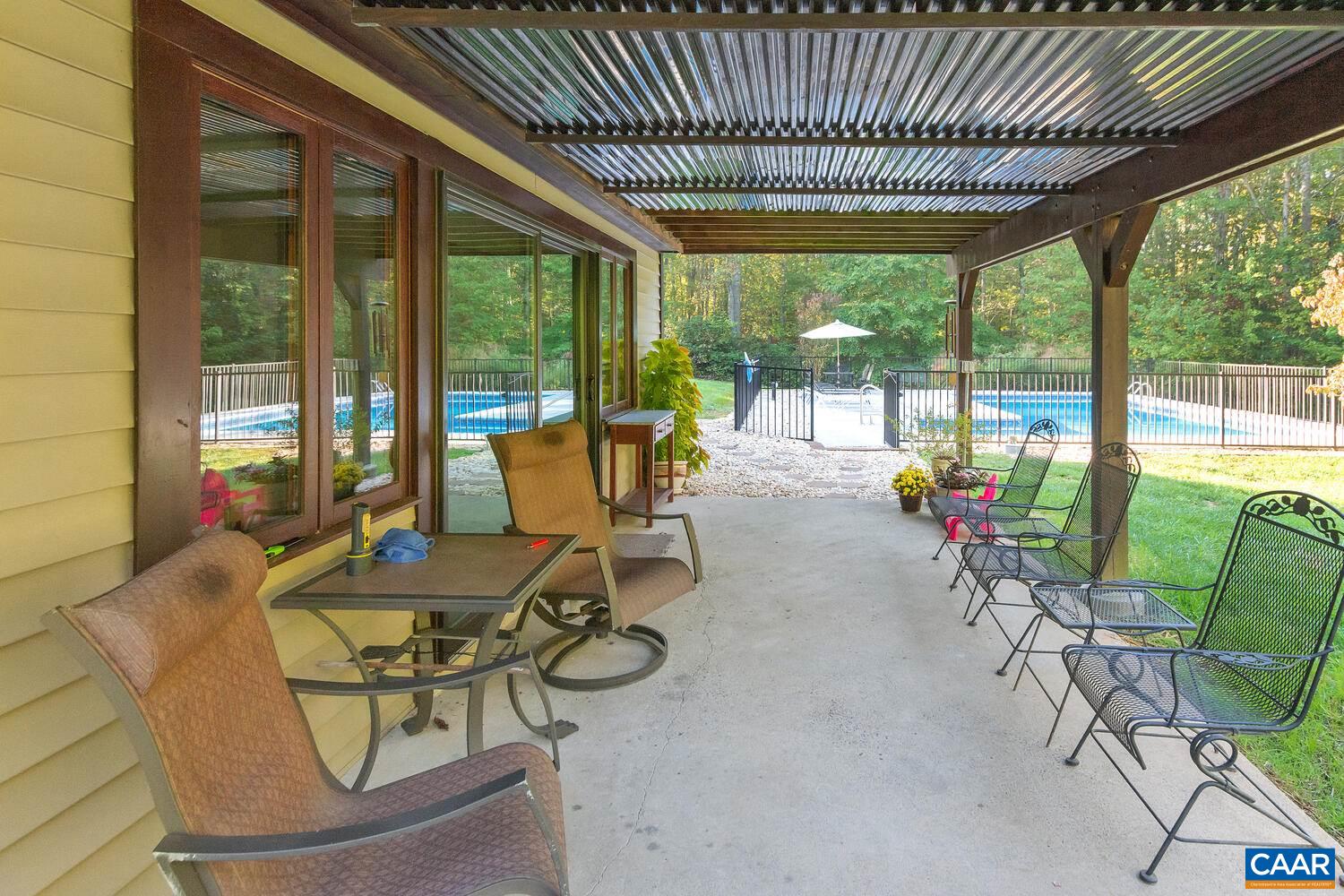 2706 Paddock Wood Road Keswick, VA 22947 - Photo 8 of 42 a building outdoor space with patio furniture and potted plants