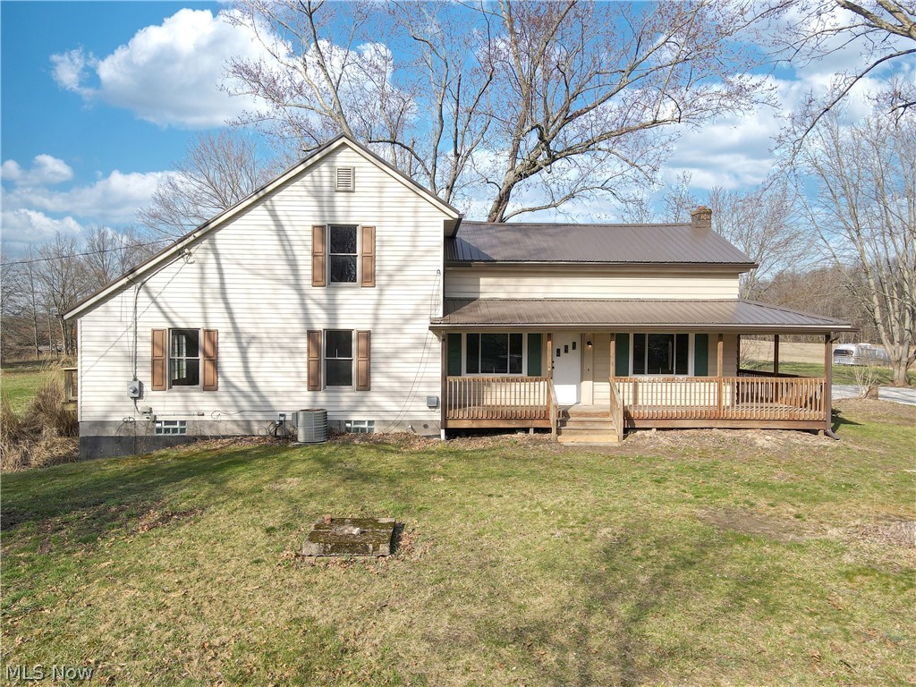 2081 Stroup Road Atwater, OH 44201 - Photo 1 of 48 Rear view of house with central AC and a yard