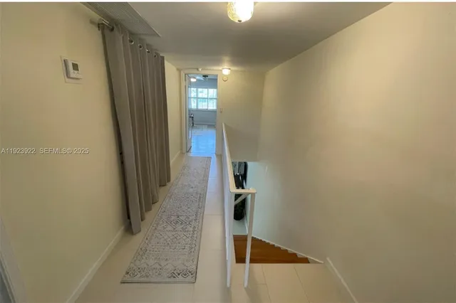 a view of hallway with stairs