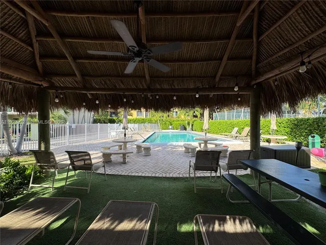 a view of a swimming pool with a patio