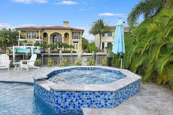 839 Enfield Street Boca Raton, FL 33487 - Photo 26 of 36 a view of a house with pool and sitting area