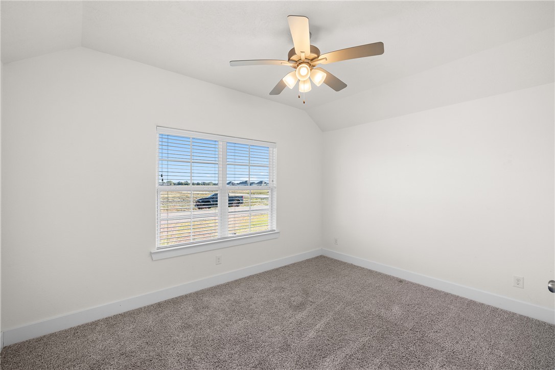 172 Pleasant Path Somerville, TX 77879 - Photo 9 of 13 an empty room with a window