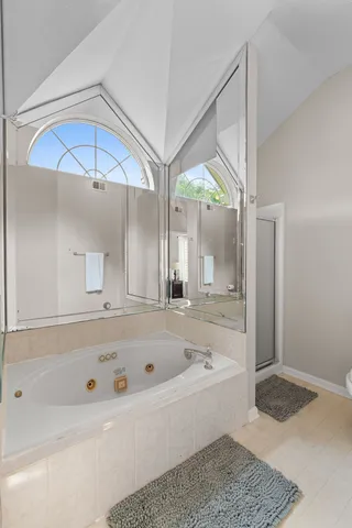 a bathroom with a bathtub and a shower