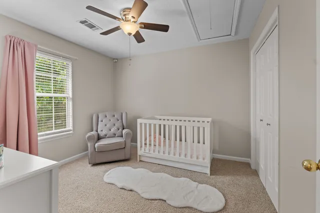 a living room with furniture and windows