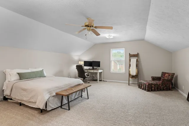 a bedroom with furniture and a bed