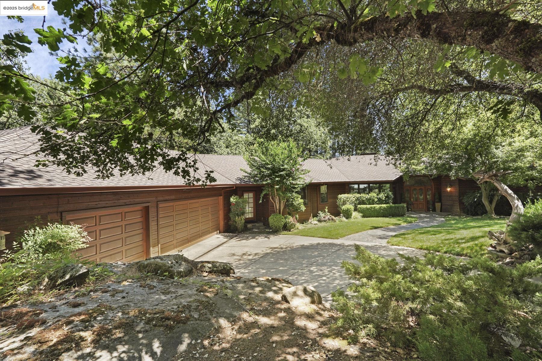 22025 Lyons Bald Mountain Road Sonora, CA 95370 - Photo 1 of 1 View of front of home with roof with shingles, concrete driveway, and a garage