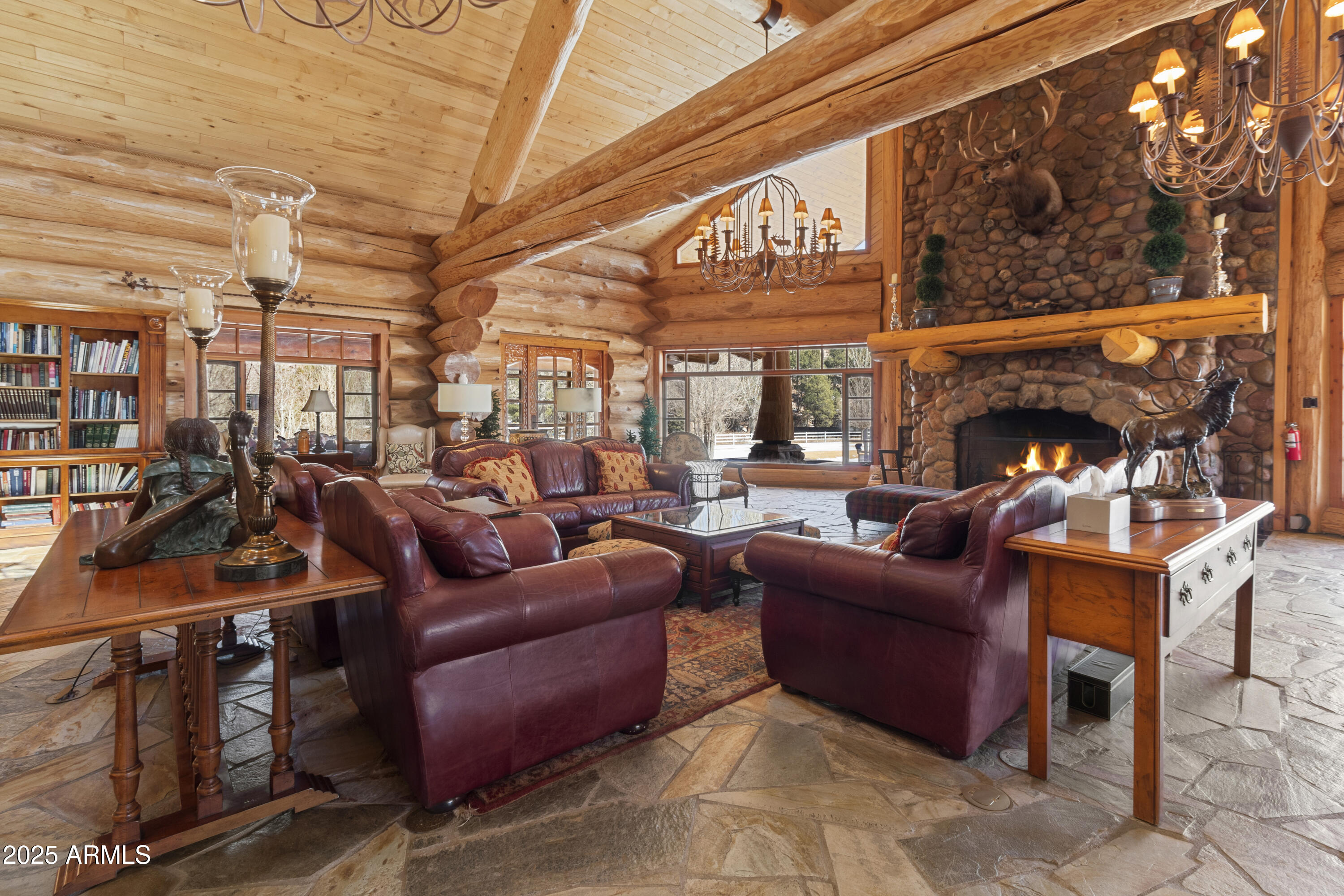1613 Black Canyon Road Heber, AZ 85928 - Photo 14 of 99 a living room with furniture a fireplace and a potted plant