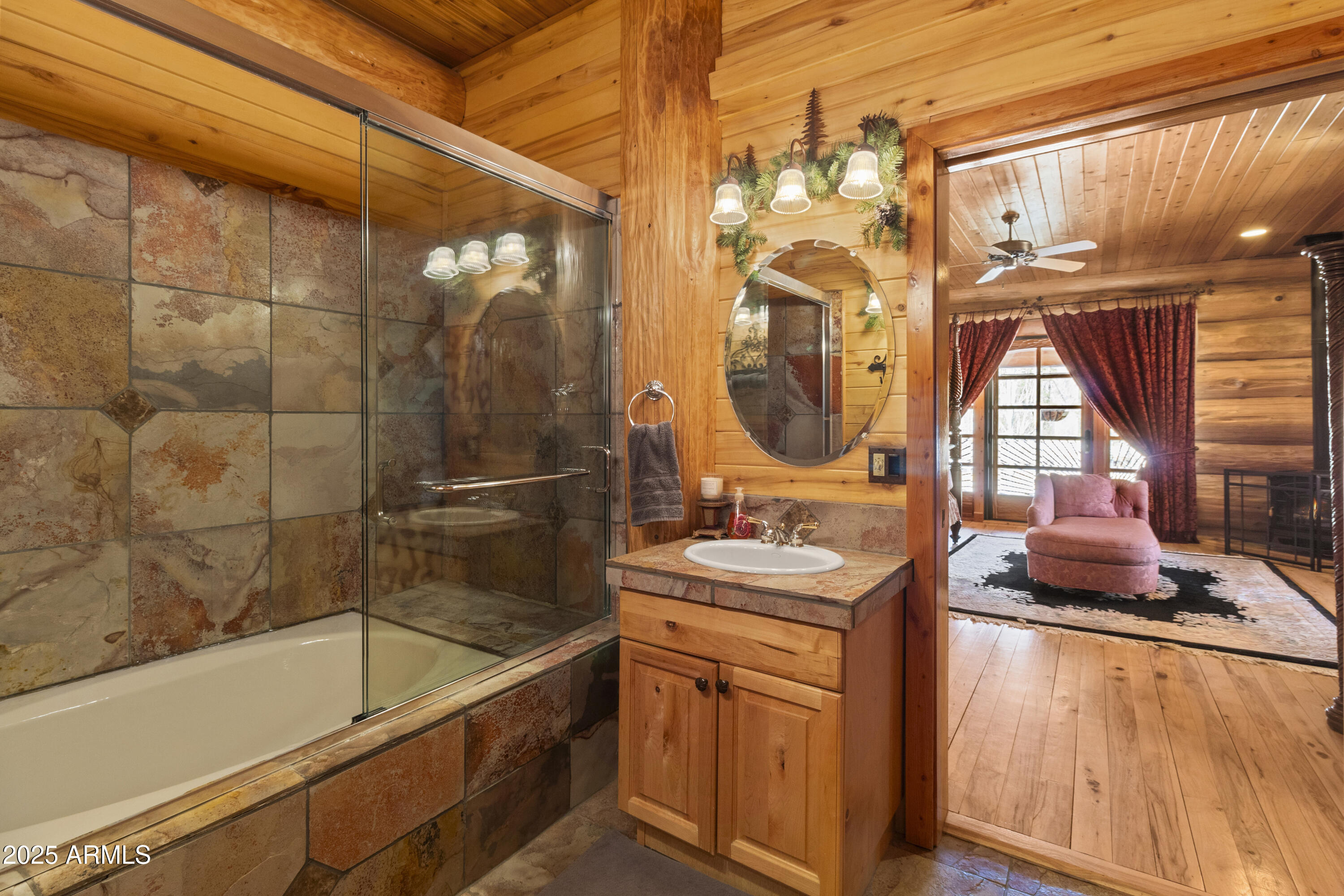 1613 Black Canyon Road Heber, AZ 85928 - Photo 21 of 99 a bathroom with a sink a vanity and mirror