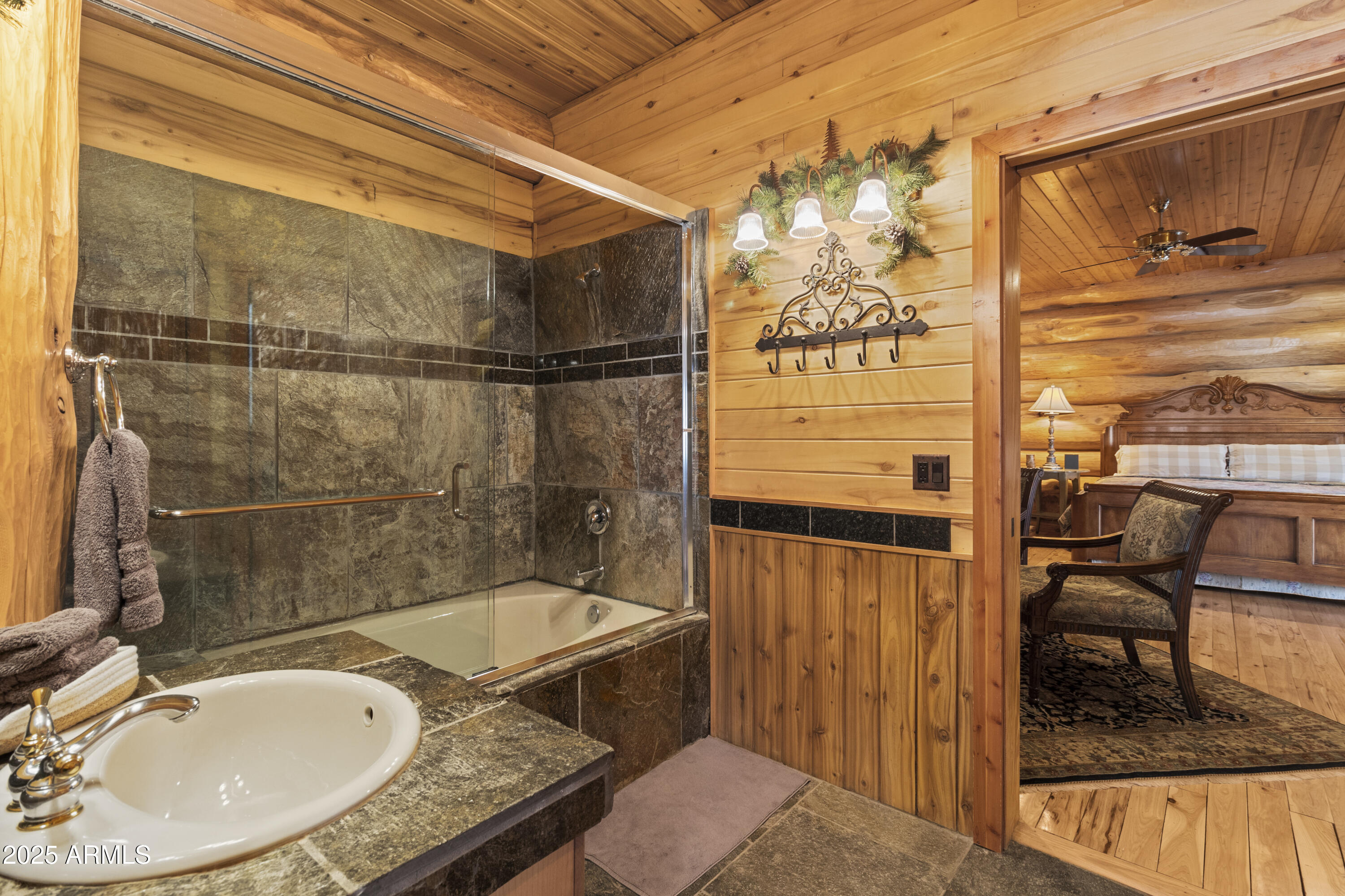 1613 Black Canyon Road Heber, AZ 85928 - Photo 28 of 98 a bathroom with a granite countertop sink and a mirror