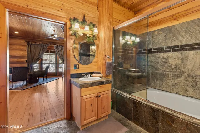 a backyard of a house with barbeque oven table and chairs