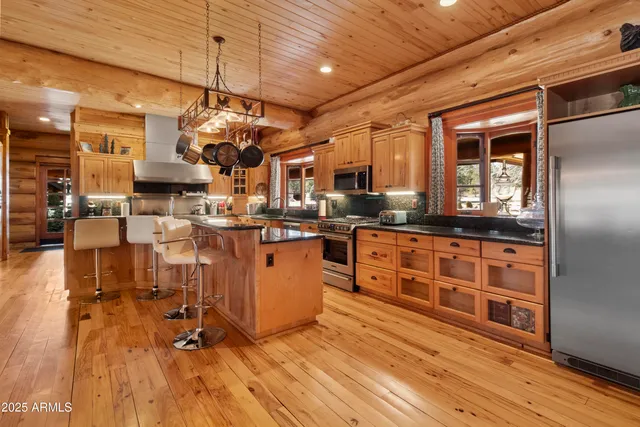 a bedroom with furniture and a large window