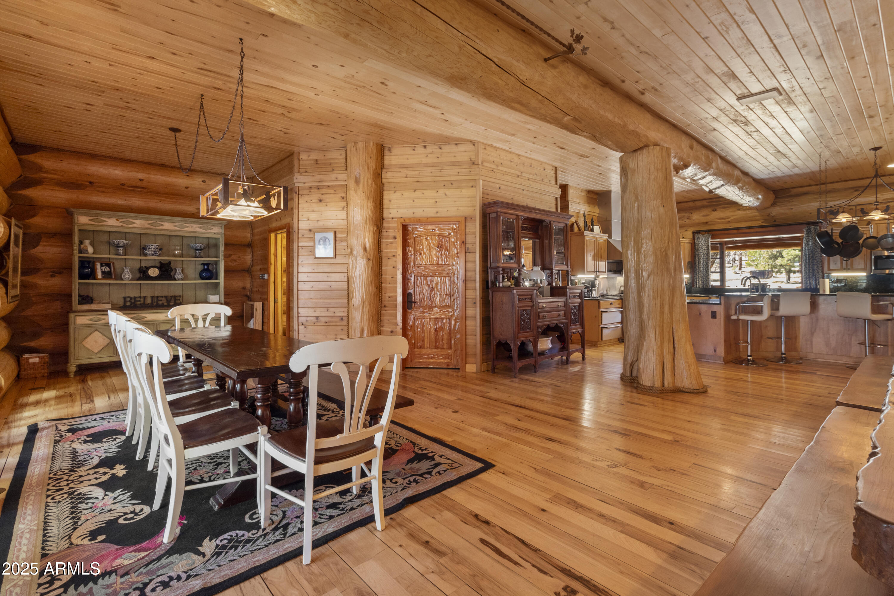 1613 Black Canyon Road Heber, AZ 85928 - Photo 39 of 99 a view of a dining room with furniture wooden floor and chandelier