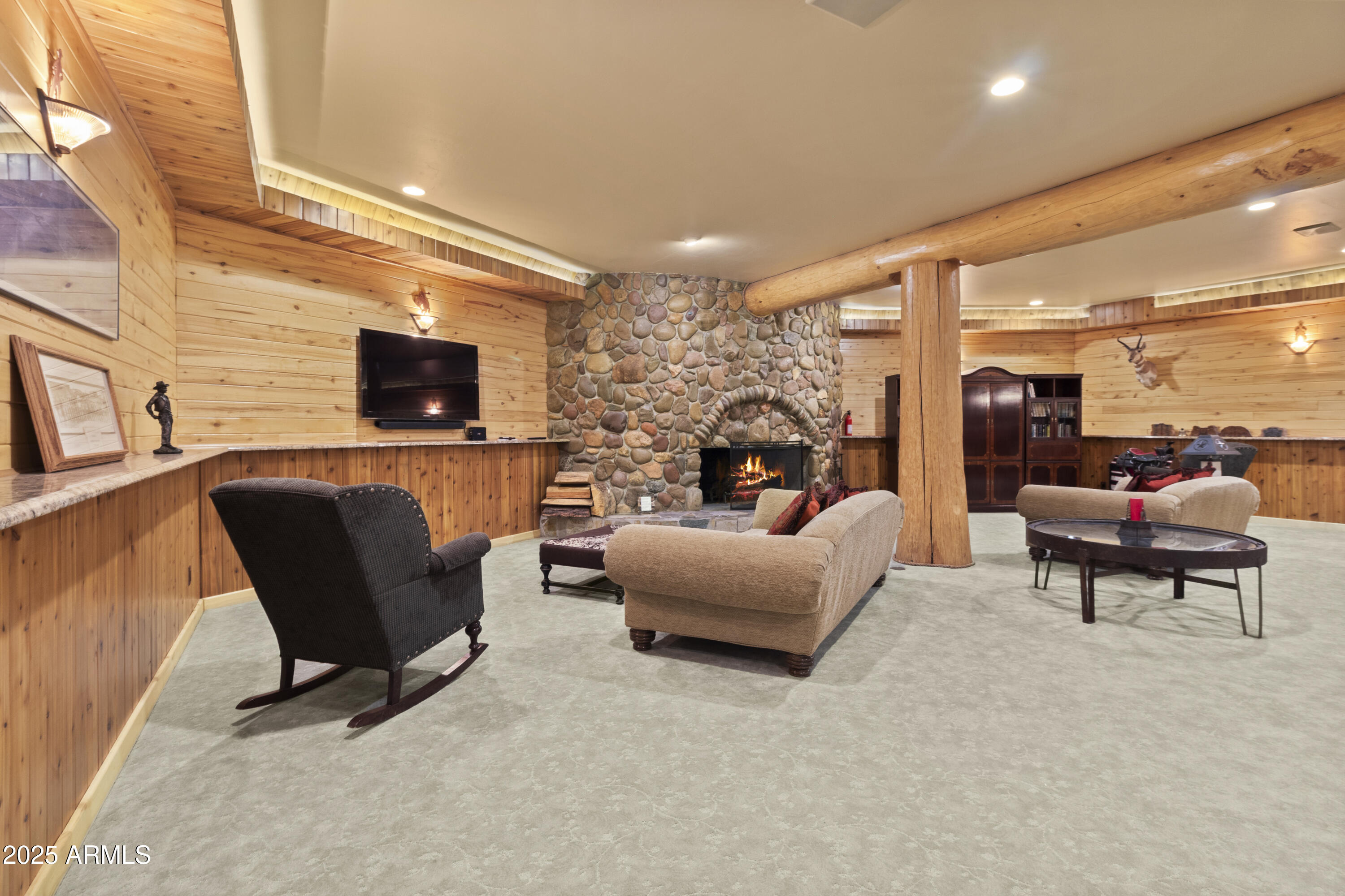 1613 Black Canyon Road Heber, AZ 85928 - Photo 44 of 98 a living room with furniture a fireplace and a flat screen tv