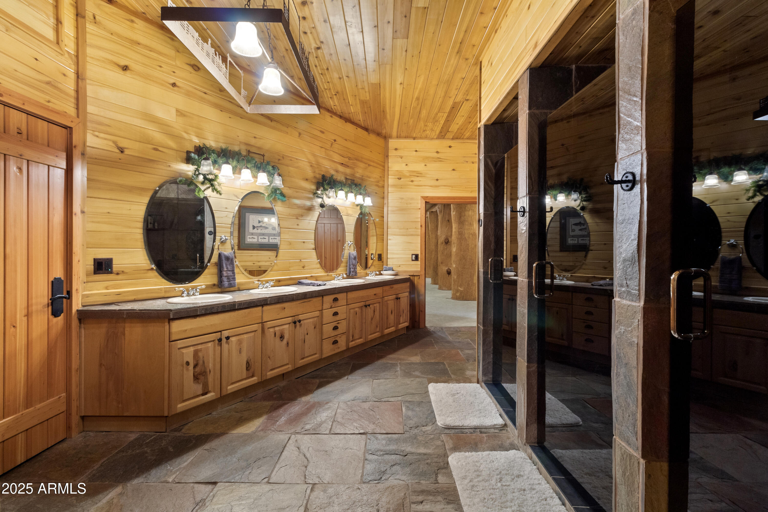 1613 Black Canyon Road Heber, AZ 85928 - Photo 49 of 99 a bathroom with a double vanity sink and mirror