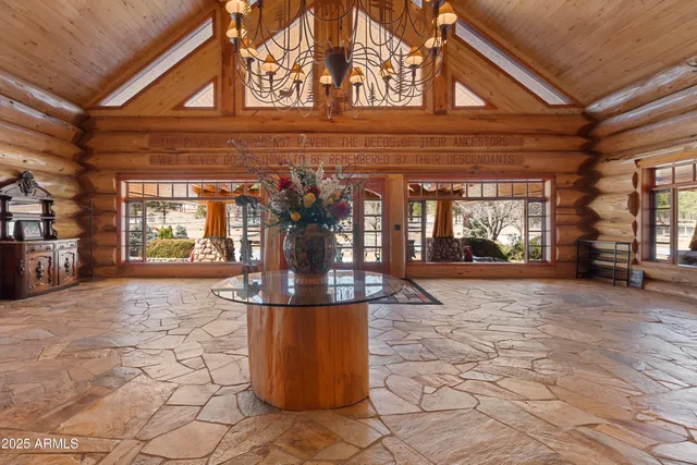 a living room with furniture a fireplace and a potted plant