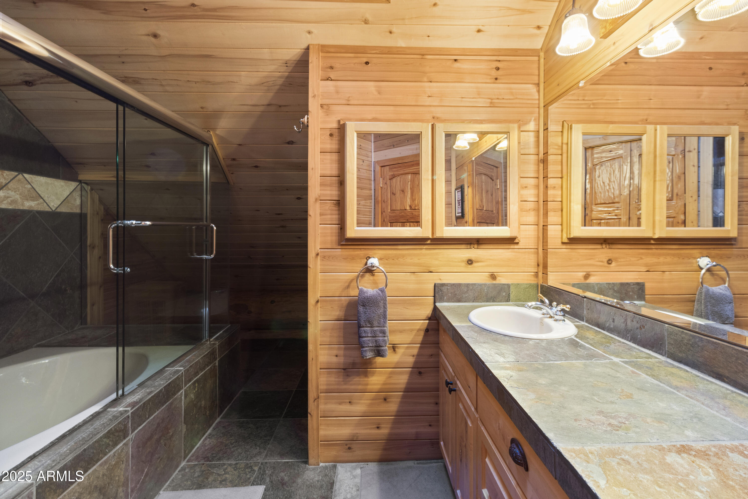 1613 Black Canyon Road Heber, AZ 85928 - Photo 60 of 98 a bathroom with a granite countertop sink and mirror with bathtub