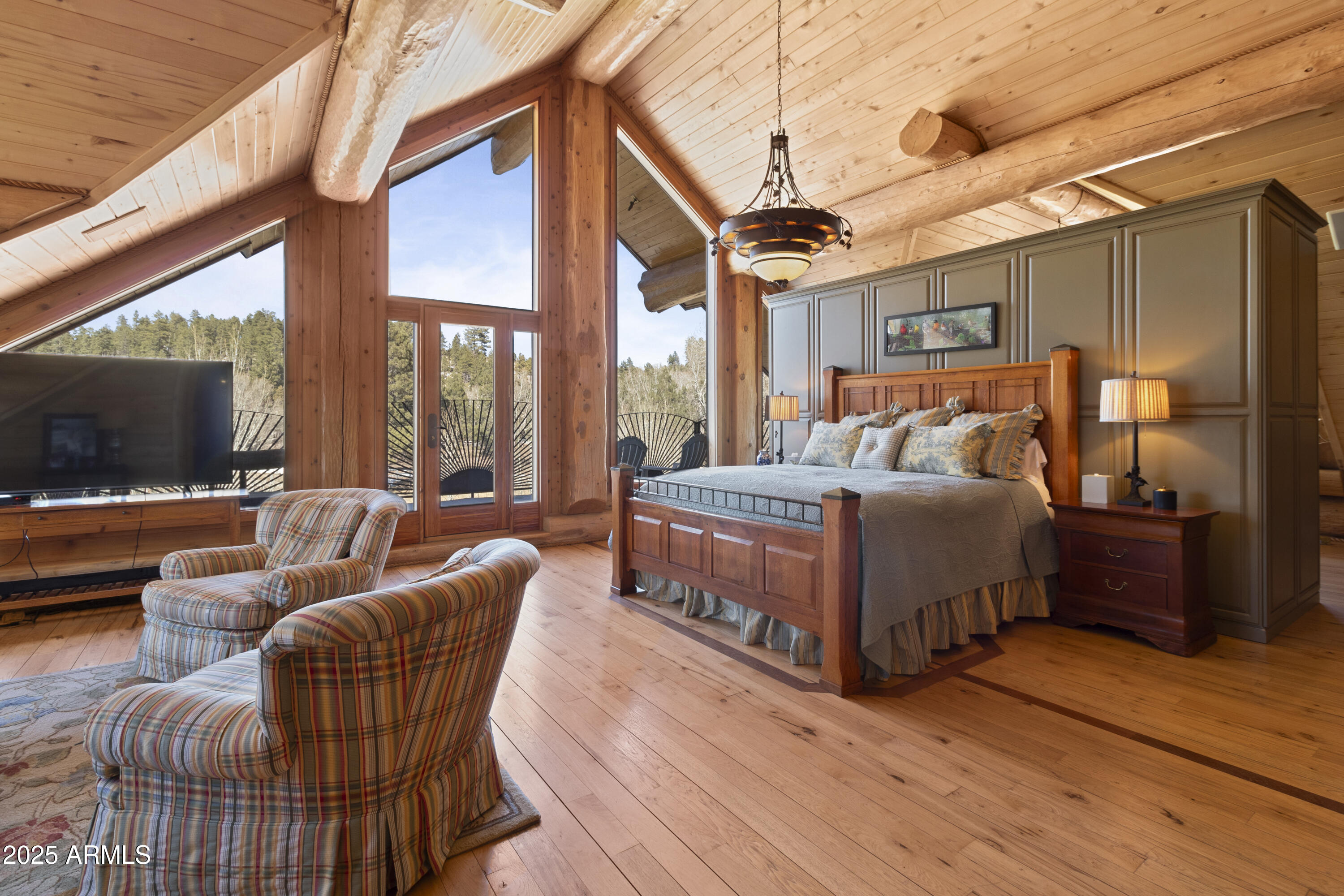 1613 Black Canyon Road Heber, AZ 85928 - Photo 61 of 98 a bedroom with furniture and a flat screen tv