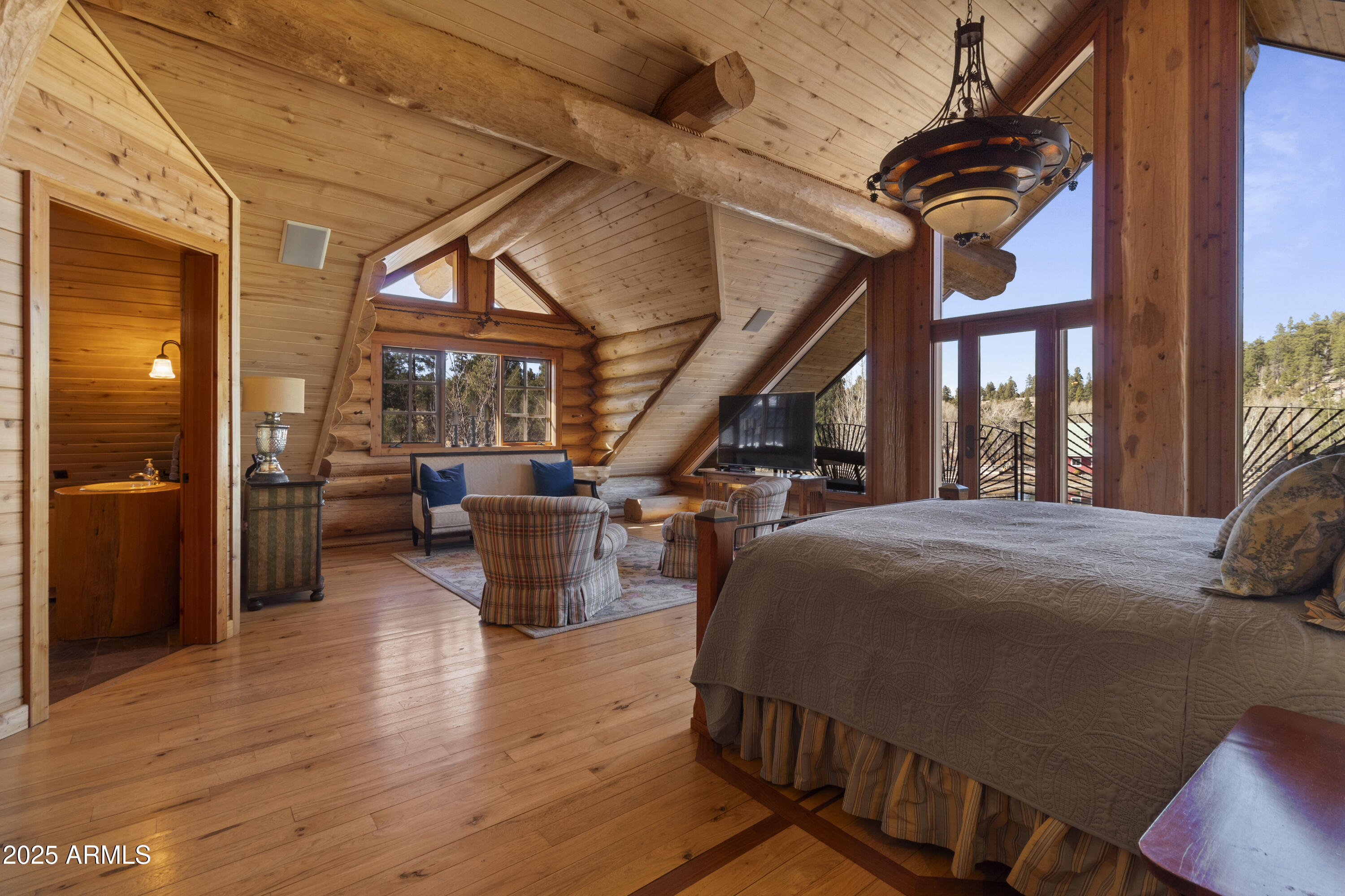 1613 Black Canyon Road Heber, AZ 85928 - Photo 63 of 98 a bedroom with furniture and a large window