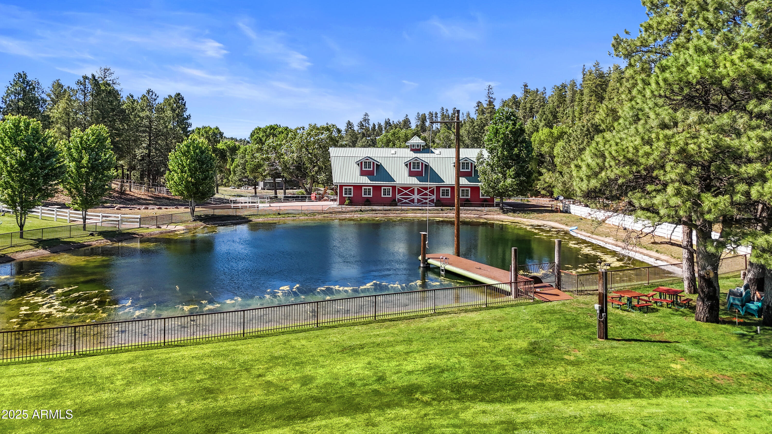 1613 Black Canyon Road Heber, AZ 85928 - Photo 79 of 98 a view of a swimming pool with lawn chairs and a big yard