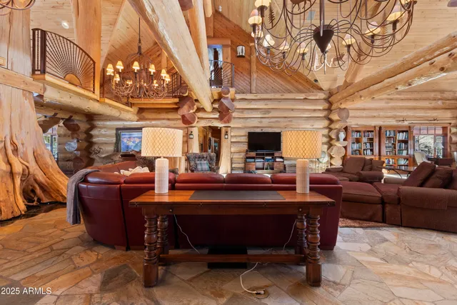 a bedroom with furniture and wooden floor