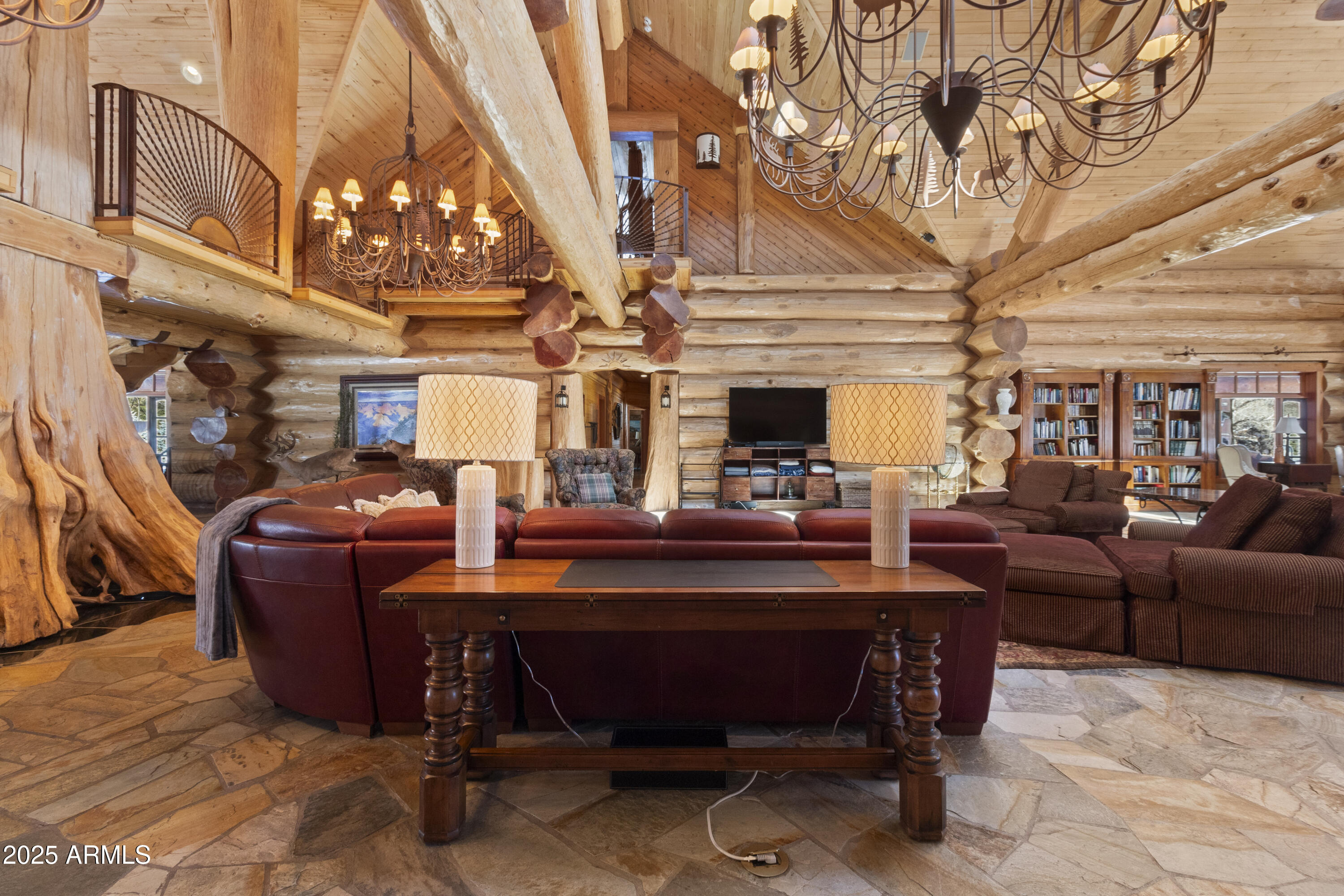 1613 Black Canyon Road Heber, AZ 85928 - Photo 9 of 99 a living room with furniture a chandelier and a fireplace