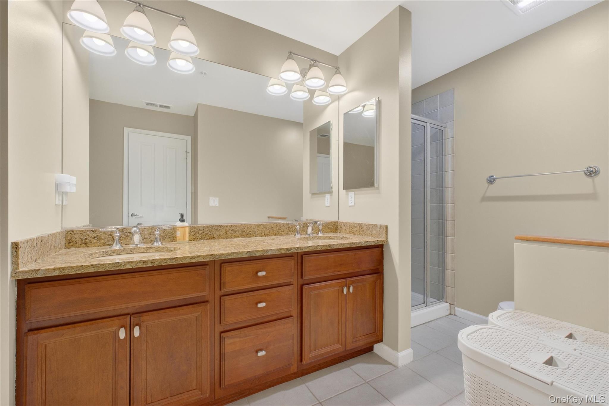 213 Riverbend Drive Peekskill, NY 10566 - Photo 19 of 46 Elegant Primary Bathroom is your own personal retreat with double sink vanity and separate shower.
