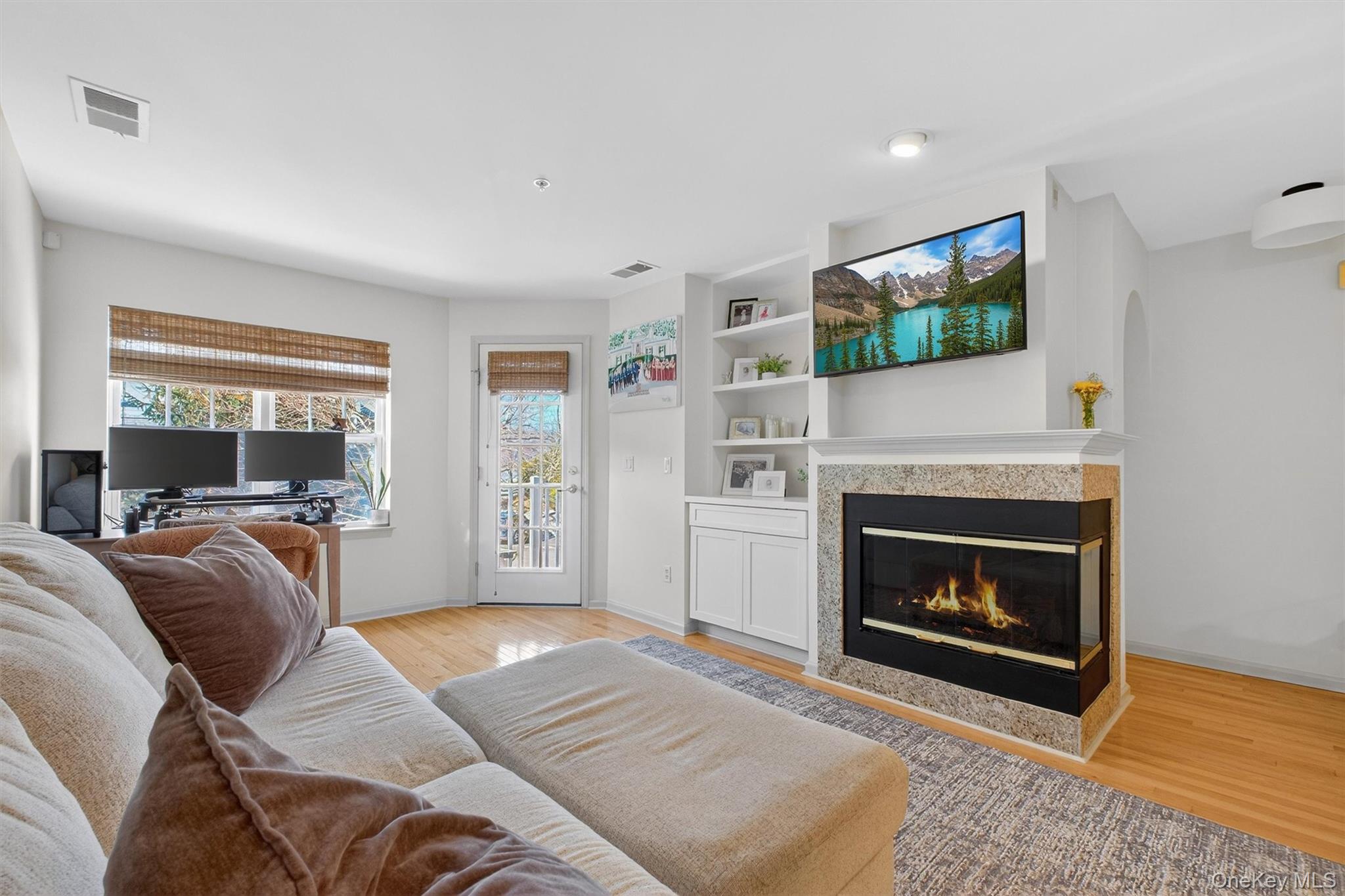 213 Riverbend Drive Peekskill, NY 10566 - Photo 3 of 46 Living Room with 2 sided corner fireplace creating a dramatic focal point and providing an uninterrupted view of the glowing flame.