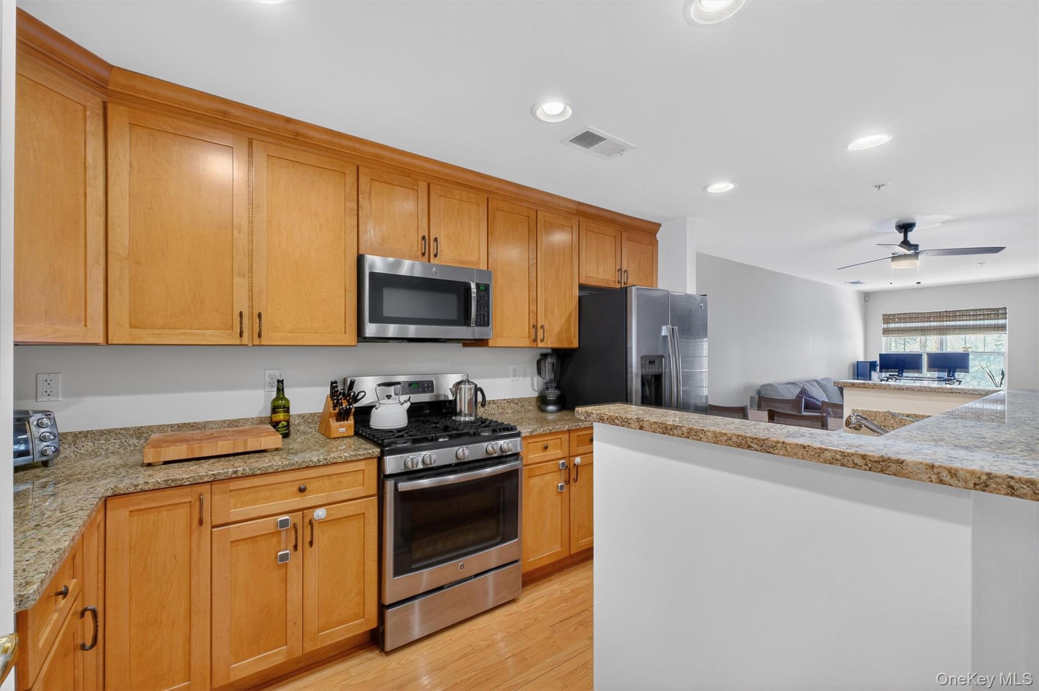 213 Riverbend Drive Peekskill, NY 10566 - Photo 9 of 46 Bright Kitchen has stainless steel appliances, granite countertops, center island and hardwood floors.
