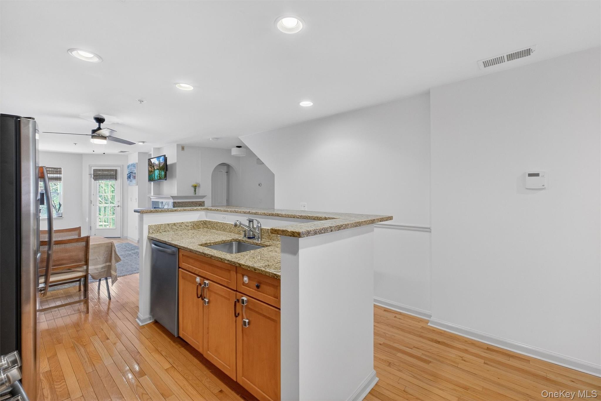 213 Riverbend Drive Peekskill, NY 10566 - Photo 10 of 46 Kitchen has recessed lighting and a two-tier center island with sink providing a stylish and efficient workflow station.