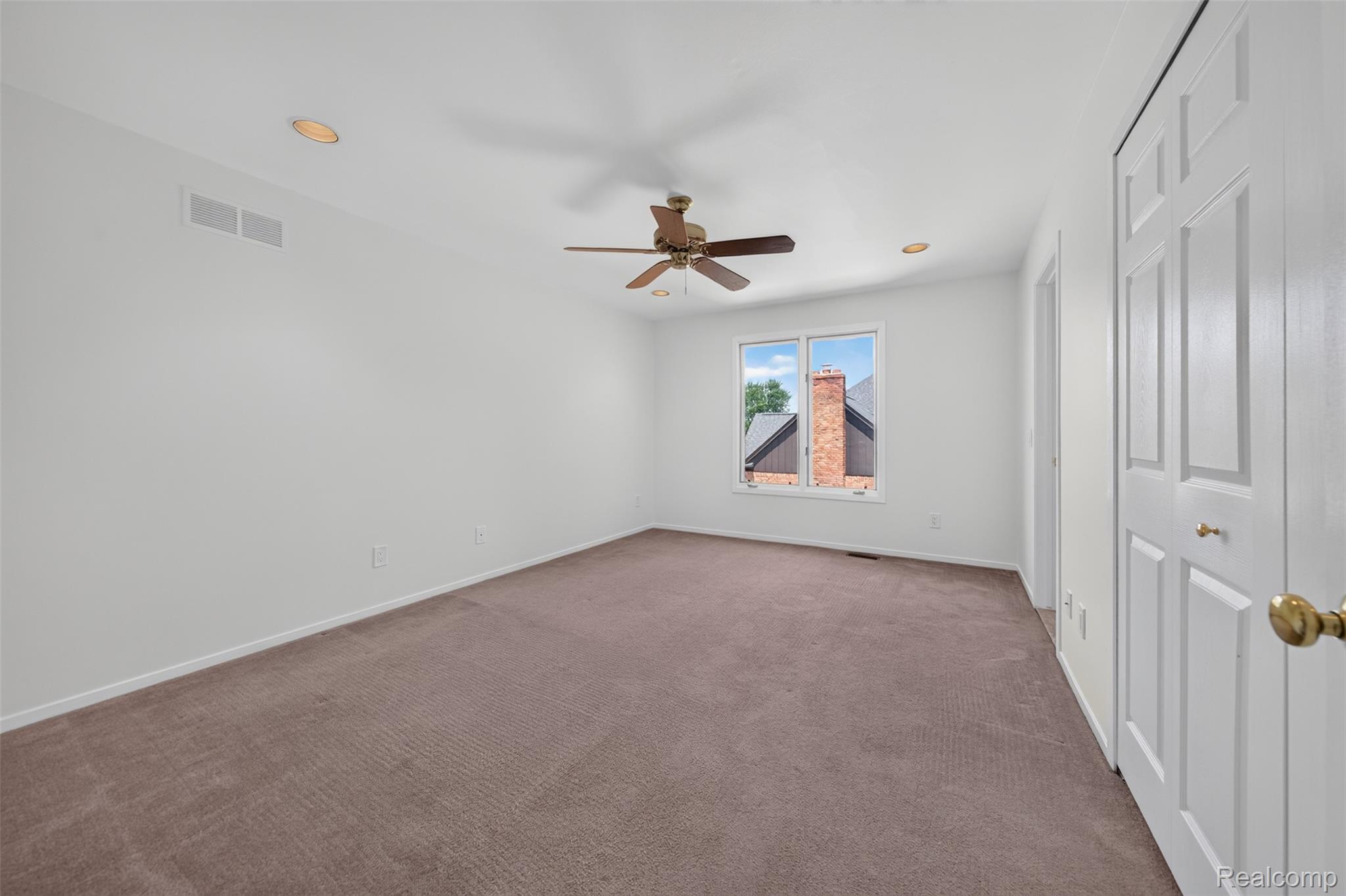 1236 Chaffer Drive Rochester, MI 48306 - Photo 36 of 76 Carpeted interior space featuring a window, ceiling fan, and recessed lighting