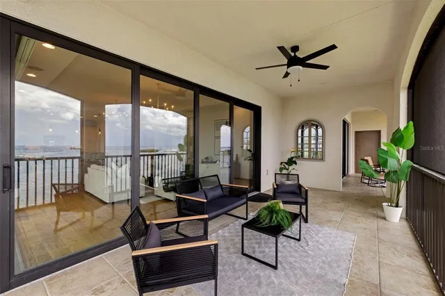 a kitchen with stainless steel appliances white cabinets and wooden floors