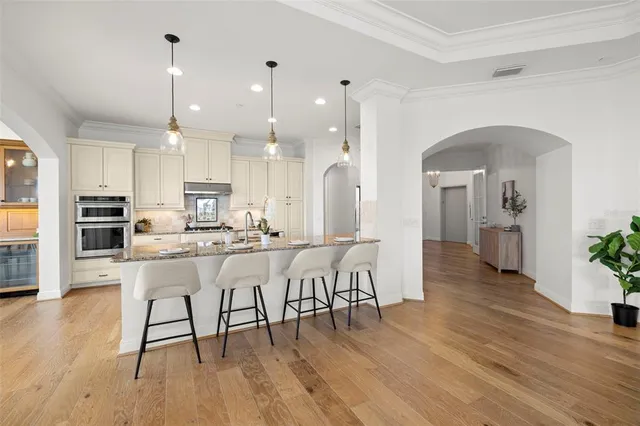 a view of a livingroom with workspace and a window