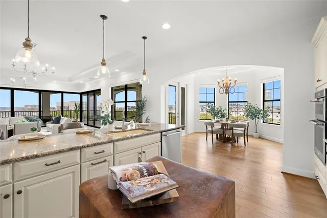 a bedroom with a bed window and potted plant on the dresser
