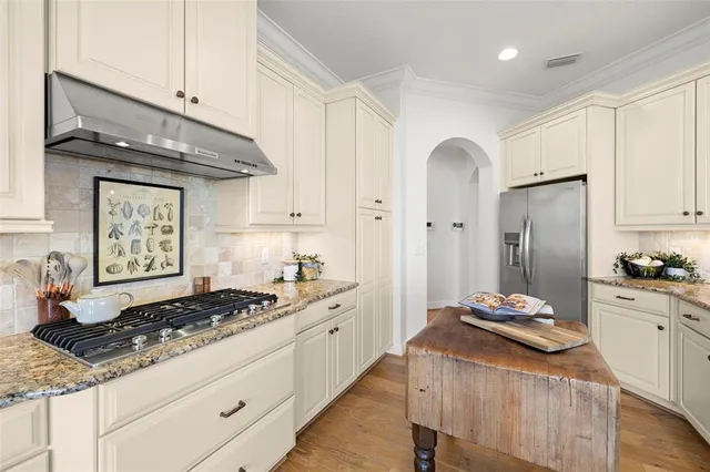 a view of a chairs and table in the balcony